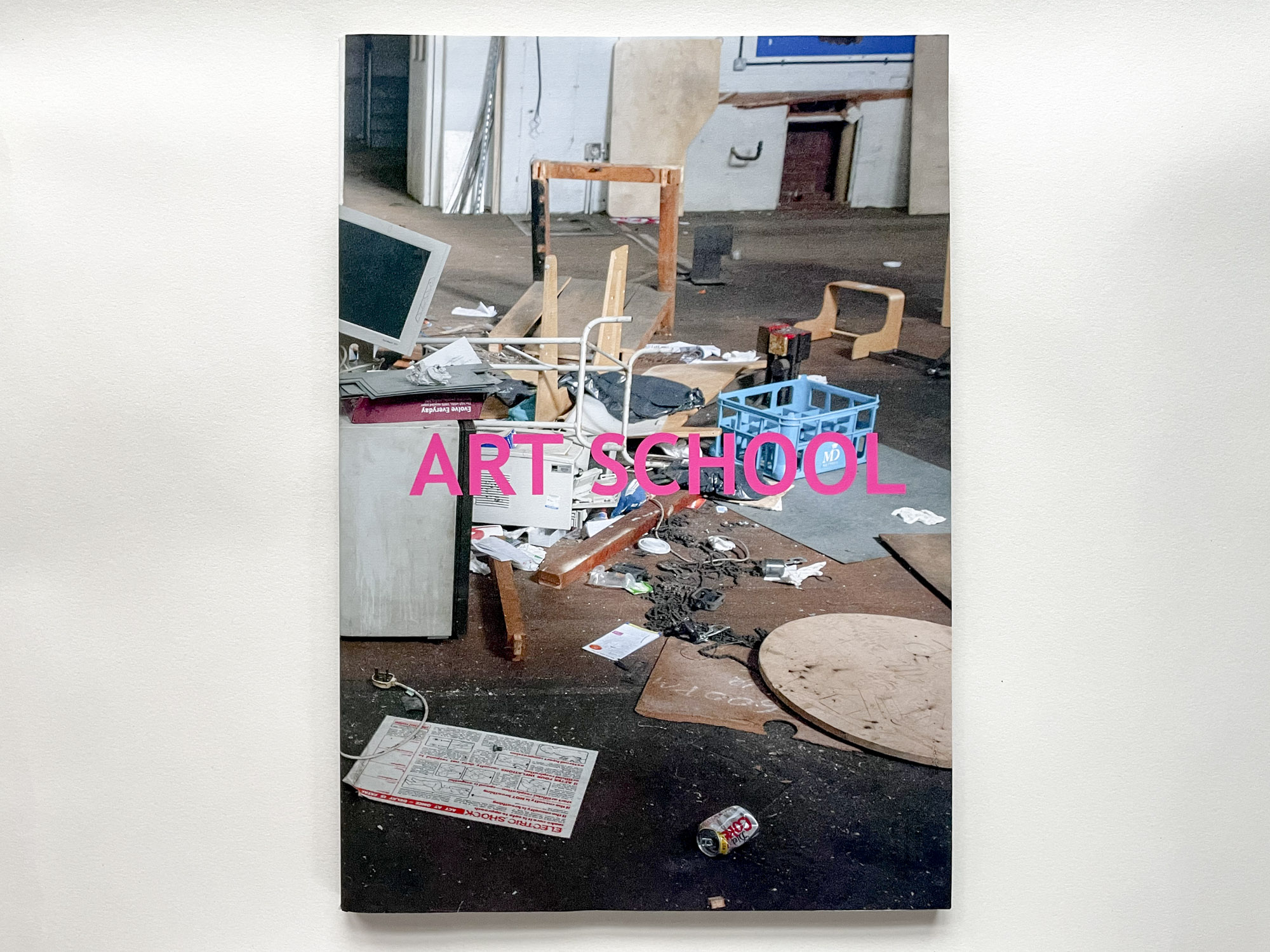 book cover showing floor covered in detritus, the title Art School is overlaid in large pink letters