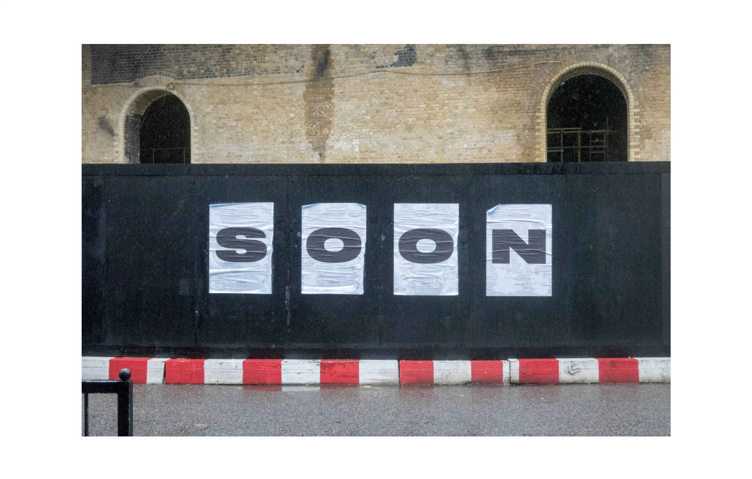 a hoarding which says Soon