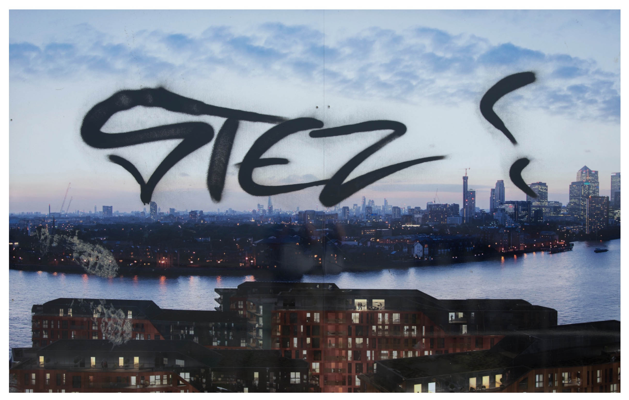an architectural mockup provides a view over the Thames and part of London, someone has spray canned STEZ! over it