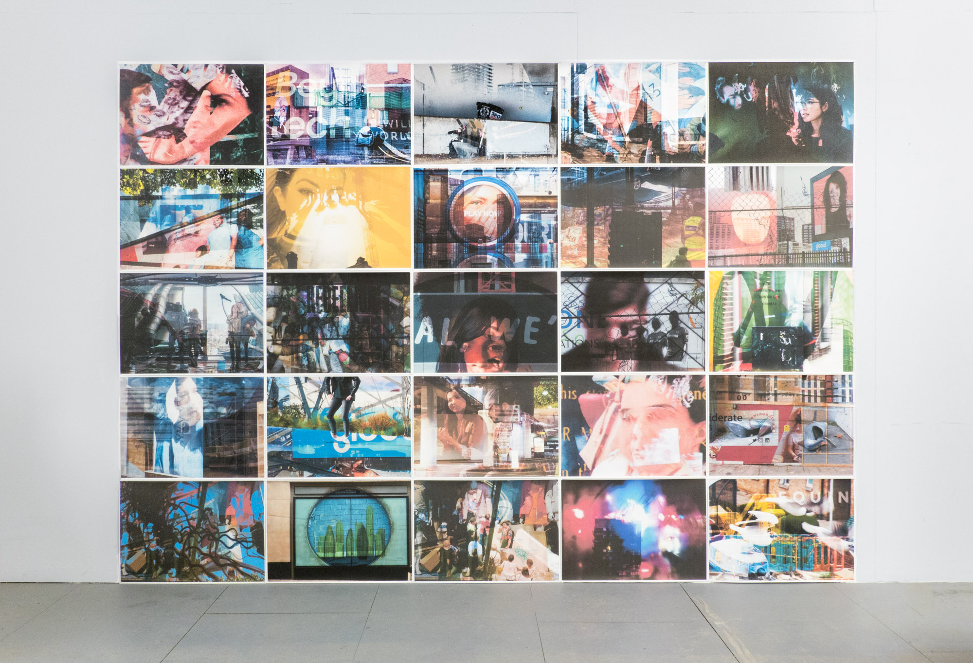 fifteen collaged photographs in a grid on a wall, on the floor beneath them are strewn six photos of the tops of skyscrapers, at the centre of each image is a Costa coffee cup