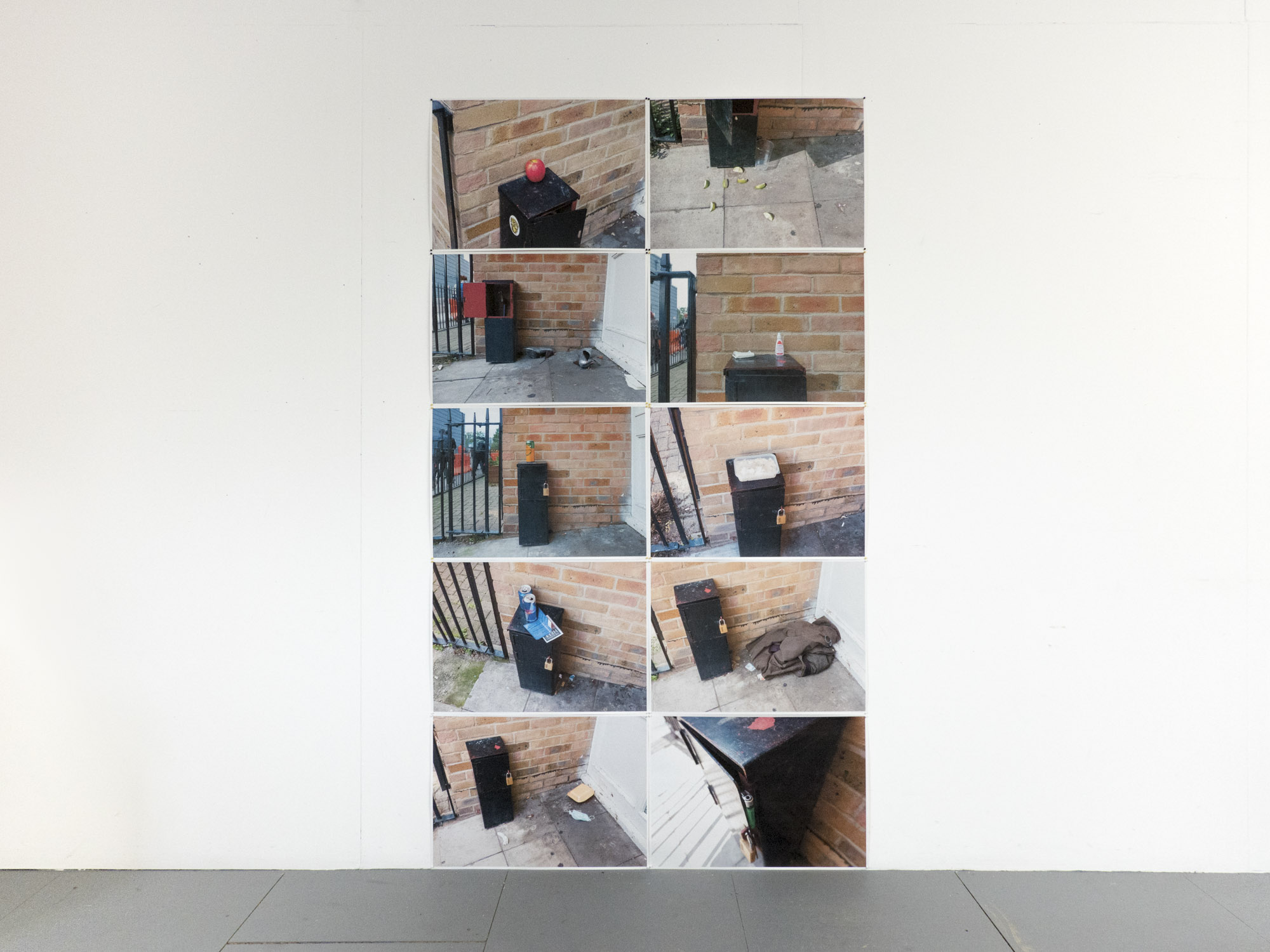 eight photographs arranged in a two by five vertical grid depicting detritus left by unknown persons in a doorway